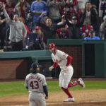
              Philadelphia Phillies' Rhys Hoskins watches his home run off Houston Astros starting pitcher Lance McCullers Jr. during the = inning in Game 3 of baseball's World Series between the Houston Astros and the Philadelphia Phillies on Tuesday, Nov. 1, 2022, in Philadelphia. (AP Photo/Matt Rourke)
            