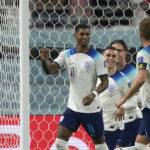 
              England's Marcus Rashford celebrates with teammates after scoring his side's fifth goal during the World Cup group B soccer match between England and Iran at the Khalifa International Stadium in Doha, Qatar, Monday, Nov. 21, 2022. (AP Photo/Frank Augstein)
            