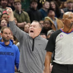 
              Denver Nuggets head coach Michael Malone, center, yells from the sideline during the fourth quarter of an NBA basketball game against the Dallas Mavericks in Dallas, Sunday, Nov. 20, 2022. (AP Photo/LM Otero)
            