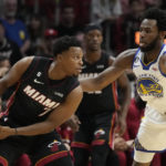 
              Miami Heat guard Kyle Lowry (7) looks for an open teammate past Golden State Warriors forward Andrew Wiggins (22) during the first half of an NBA basketball game, Tuesday, Nov. 1, 2022, in Miami. (AP Photo/Wilfredo Lee)
            