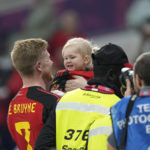 
              Belgium's Kevin De Bruyne smiles with a baby at the end of the World Cup group F soccer match between Belgium and Canada, at the Ahmad Bin Ali Stadium in Doha, Qatar, Wednesday, Nov. 23, 2022. Belgium won 1-0. (AP Photo/Martin Meissner)
            