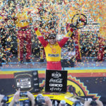 
              Joey Logano celebrates after winning a NASCAR Cup Series auto race and championship Sunday, Nov. 6, 2022, in Avondale, Ariz. (AP Photo/Rick Scuteri)
            