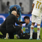 
              Tottenham's Son Heung-min receives treatment after taking a knock during the Champions League Group D soccer match between Marseille and Tottenham Hotspur at the Stade Velodrome in Marseille, France, Tuesday, Nov. 1, 2022. (AP Photo/Daniel Cole)
            