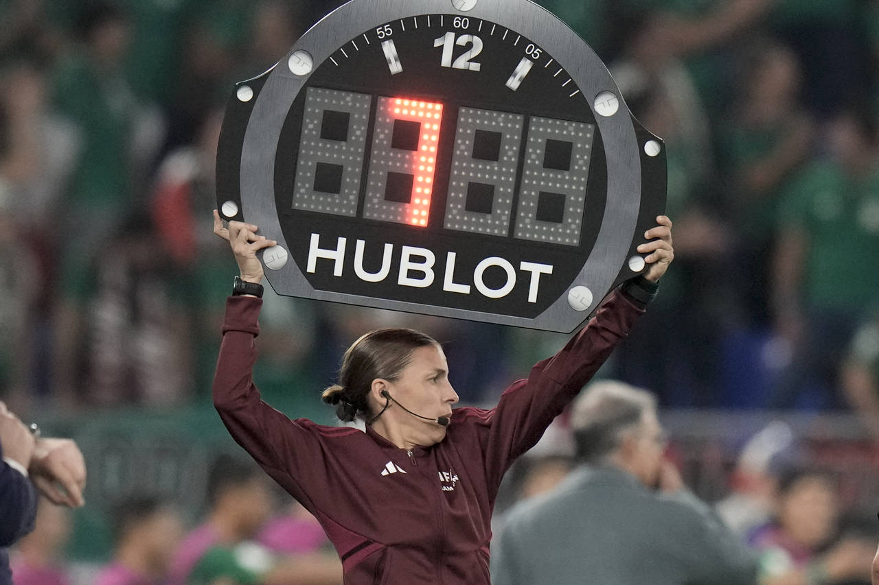 Referee assistant Stephanie Frappart of France shows 7 minutes overtime during the World Cup group ...