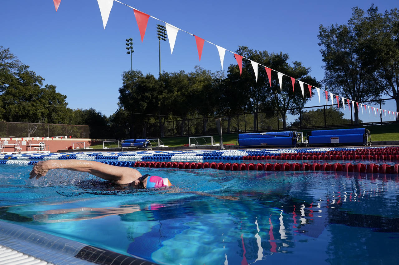 Stanford women's basketball head coach Tara VanDerveer swims in the school's Olympic-size pool in S...