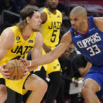 
              Los Angeles Clippers forward Nicolas Batum, right, steals the ball from Utah Jazz forward Kelly Olynyk during the second half of an NBA basketball game Monday, Nov. 21, 2022, in Los Angeles. (AP Photo/Mark J. Terrill)
            