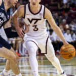 
              Virginia Tech's Sean Pedulla (3) drives against Penn State's Andrew Funk (10) in the first half of an NCAA college basketball game at the Charleston Classic in Charleston, S.C., Friday, Nov. 18, 2022. (AP Photo/Mic Smith)
            