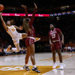 
              Tennessee guard Jasmine Powell (15) shoots next to Massachusetts forward Angelique Ngalakulondi (30) during the first half of an NCAA college basketball game, Thursday, Nov. 10, 2022, in Knoxville, Tenn. (AP Photo/Wade Payne)
            