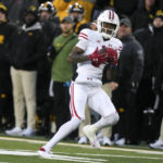 
              Wisconsin wide receiver Keontez Lewis (3) catches a 51-yard pass for a touchdown during the first half of an NCAA college football game against Iowa, Saturday, Nov. 12, 2022, in Iowa City, Iowa. (AP Photo/Charlie Neibergall)
            