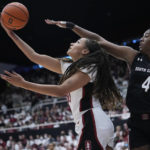 
              Stanford guard Haley Jones, left, shoots while defended by South Carolina forward Aliyah Boston (4) during the second half of an NCAA college basketball game in Stanford, Calif., Sunday, Nov. 20, 2022. (AP Photo/Godofredo A. Vásquez)
            