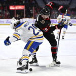 
              Ottawa Senators right wing Drake Batherson (19) works to control the puck past Buffalo Sabres center Vinnie Hinostroza (29) during the second period of an NHL hockey game, Wednesday, Nov. 16, 2022 in Ottawa, Ontario. (Justin Tang/The Canadian Press via PA)
            