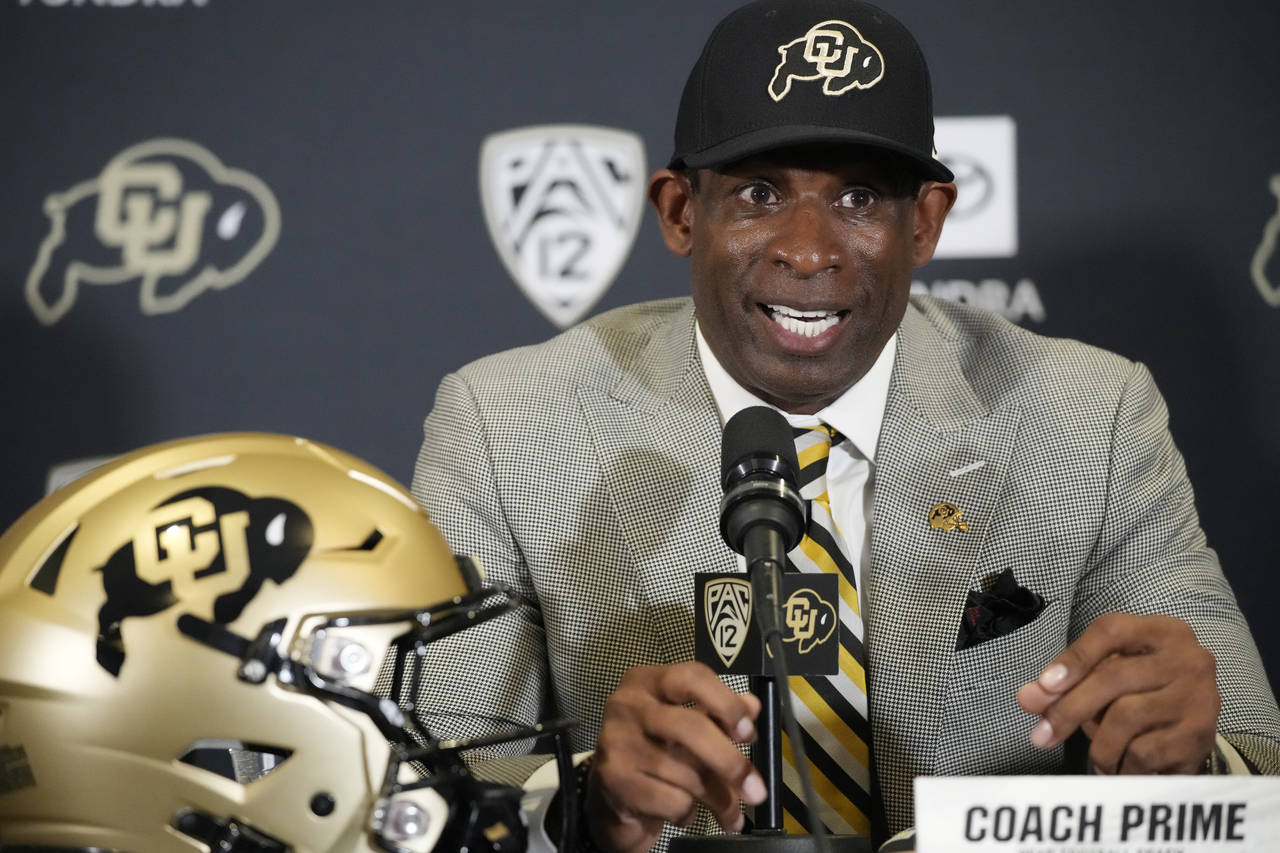 Deion Sanders speaks after being introduced as the new head NCAA college football coach at Colorado...