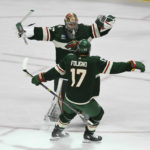 
              Minnesota Wild goalie Filip Gustavsson (32) celebrates with left wing Marcus Foligno (17) after defeating the Anaheim Ducks in a shootout in an NHL hockey game Saturday, Dec. 3, 2022, in St. Paul, Minn. (AP Photo/Craig Lassig)
            