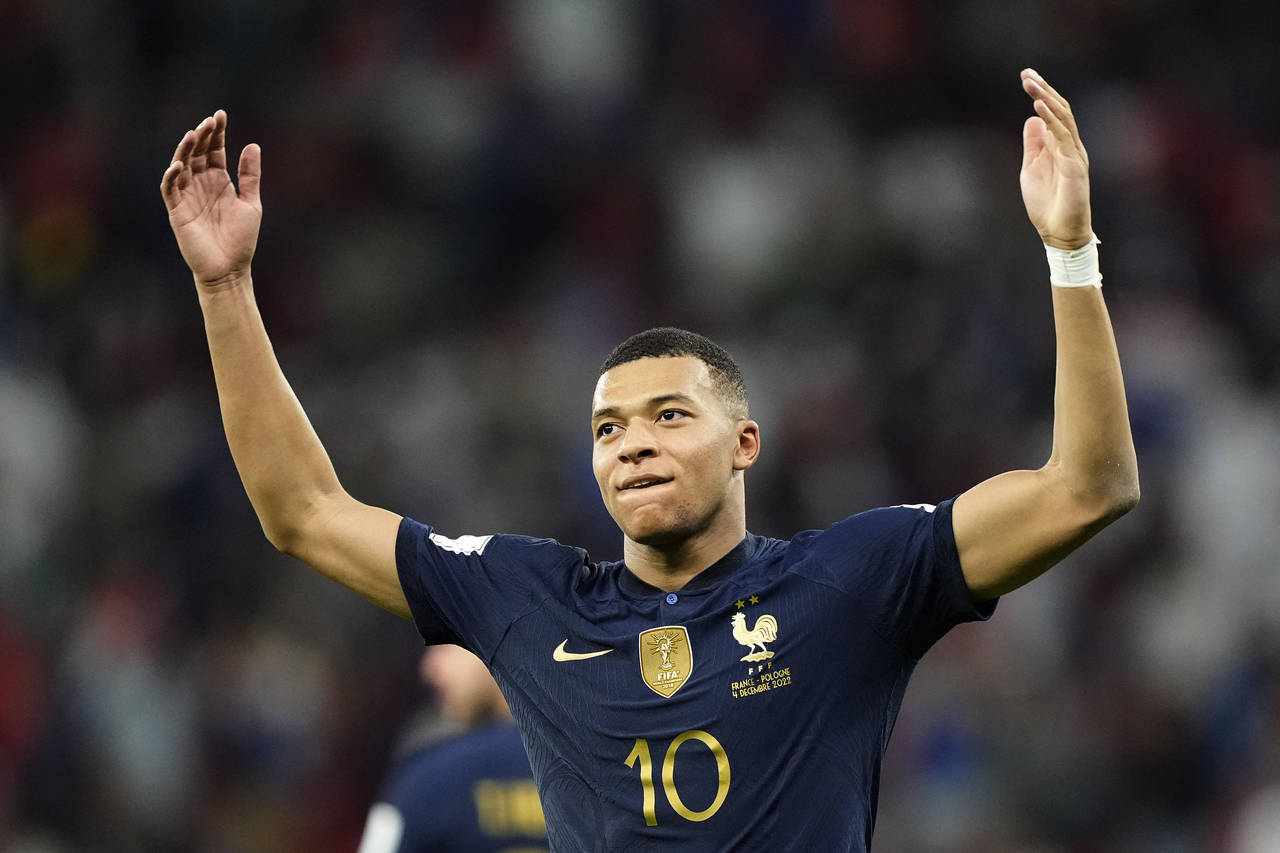 France's Kylian Mbappe celebrates scoring his side's third goal during the World Cup round of 16 so...