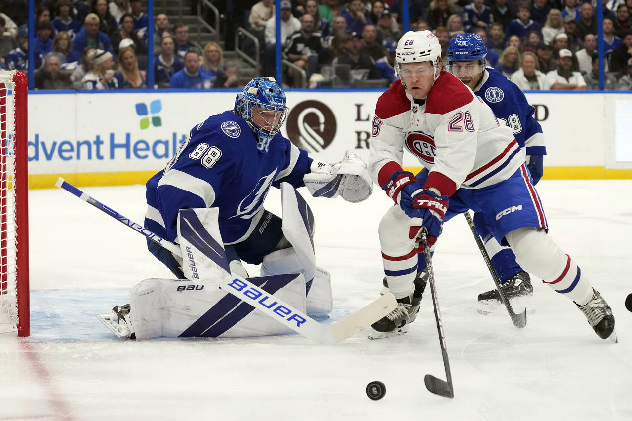 Tampa Bay Lightning goaltender Andrei Vasilevskiy (88) makes a save on a shot by Montreal Canadiens...