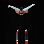 
              Giarnni Regini-Moran of Team England competes in the Men's Parallel Bars finals at the Commonwealth Games, in Birmingham, England, Tuesday, Aug. 2, 2022. (AP Photo/Manish Swarup)
            