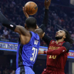 
              Cleveland Cavaliers guard Darius Garland (10) shoots against Orlando Magic guard Terrence Ross (31) during the first half of an NBA basketball game Friday, Dec. 2, 2022, in Cleveland. (AP Photo/Ron Schwane)
            