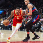 
              Atlanta Hawks guard Dejounte Murray drives to the basket against Detroit Pistons forward Kevin Knox II during the first half of an NBA basketball game Friday, Dec. 23, 2022, in Atlanta. (AP Photo/Hakim Wright Sr.)
            