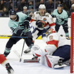
              Seattle Kraken right wing Oliver Bjorkstrand (22) shoots against Florida Pahthers goaltender Spencer Knight, who blocked the shot during the second period of an NHL hockey game Saturday, Dec. 3, 2022, in Seattle. (AP Photo/John Froschauer)
            