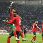 
              Morocco's Youssef En-Nesyri, right, celebrates after scoring his side's first goal during the World Cup quarterfinal soccer match between Morocco and Portugal, at Al Thumama Stadium in Doha, Qatar, Saturday, Dec. 10, 2022. (AP Photo/Martin Meissner)
            