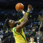 
              Oregon forward Quincy Guerrier (13) shoots against Washington State during the first half of an NCAA college basketball game in Eugene, Ore., Thursday, Dec. 1, 2022. (AP Photo/Thomas Boyd)
            