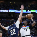 
              Minnesota Timberwolves center Naz Reid (11) goes to the basket against New Orleans Pelicans forward Larry Nance Jr. (22) in the first half of an NBA basketball game in New Orleans, Wednesday, Dec. 28, 2022. (AP Photo/Gerald Herbert)
            