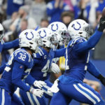 
              Indianapolis Colts' Kwity Paye (51) celebrates a fumble recovery during the second half of an NFL football game against the Los Angeles Chargers, Monday, Dec. 26, 2022, in Indianapolis. (AP Photo/Michael Conroy)
            