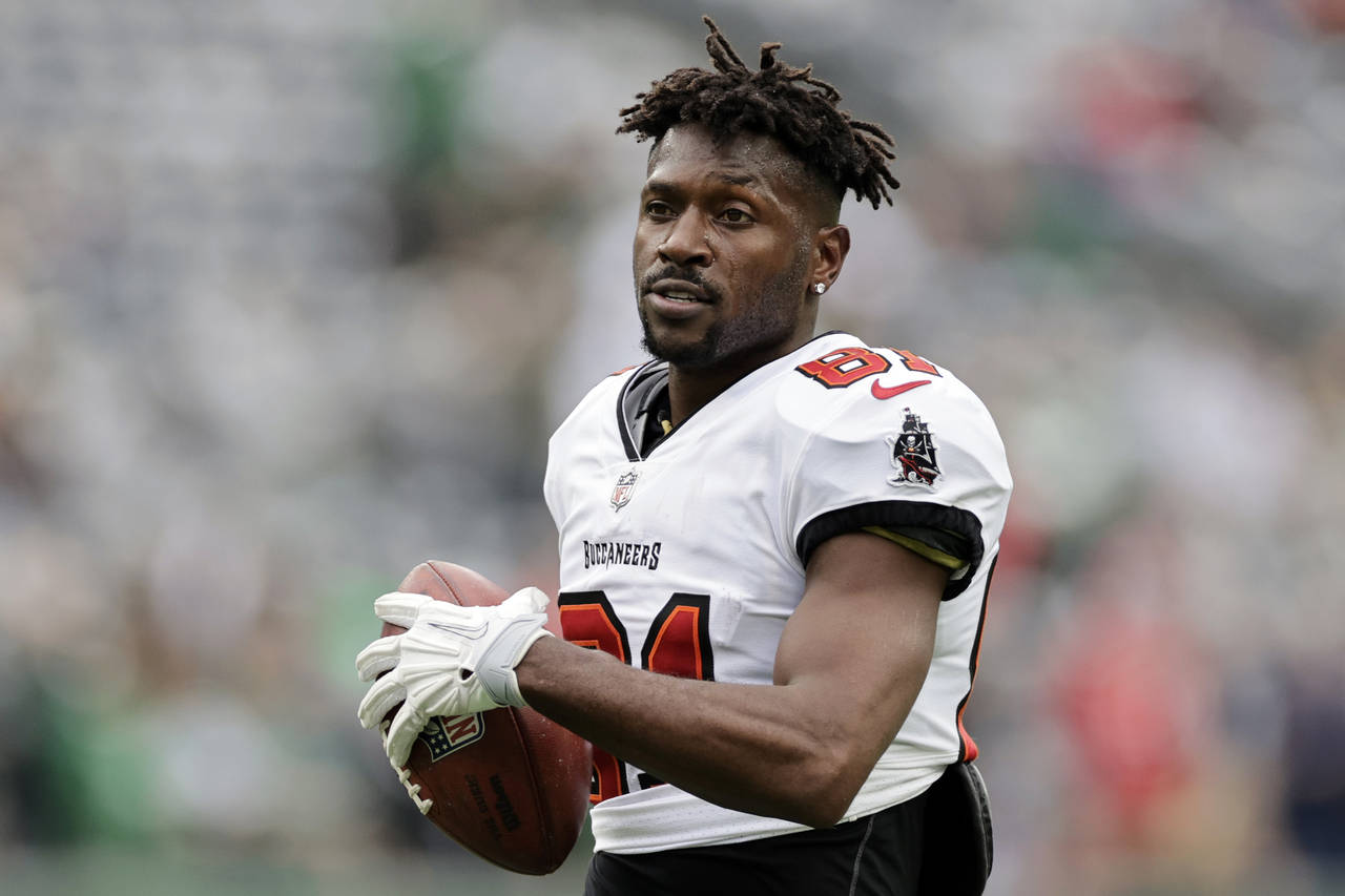 FILE - Tampa Bay Buccaneers wide receiver Antonio Brown (81) walks on the field during an NFL footb...