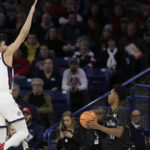 
              Kent State forward Miryne Thomas, right, prepares to shoot while defended by Gonzaga guard Julian Strawther during the first half of an NCAA college basketball game, Monday, Dec. 5, 2022, in Spokane, Wash. (AP Photo/Young Kwak)
            