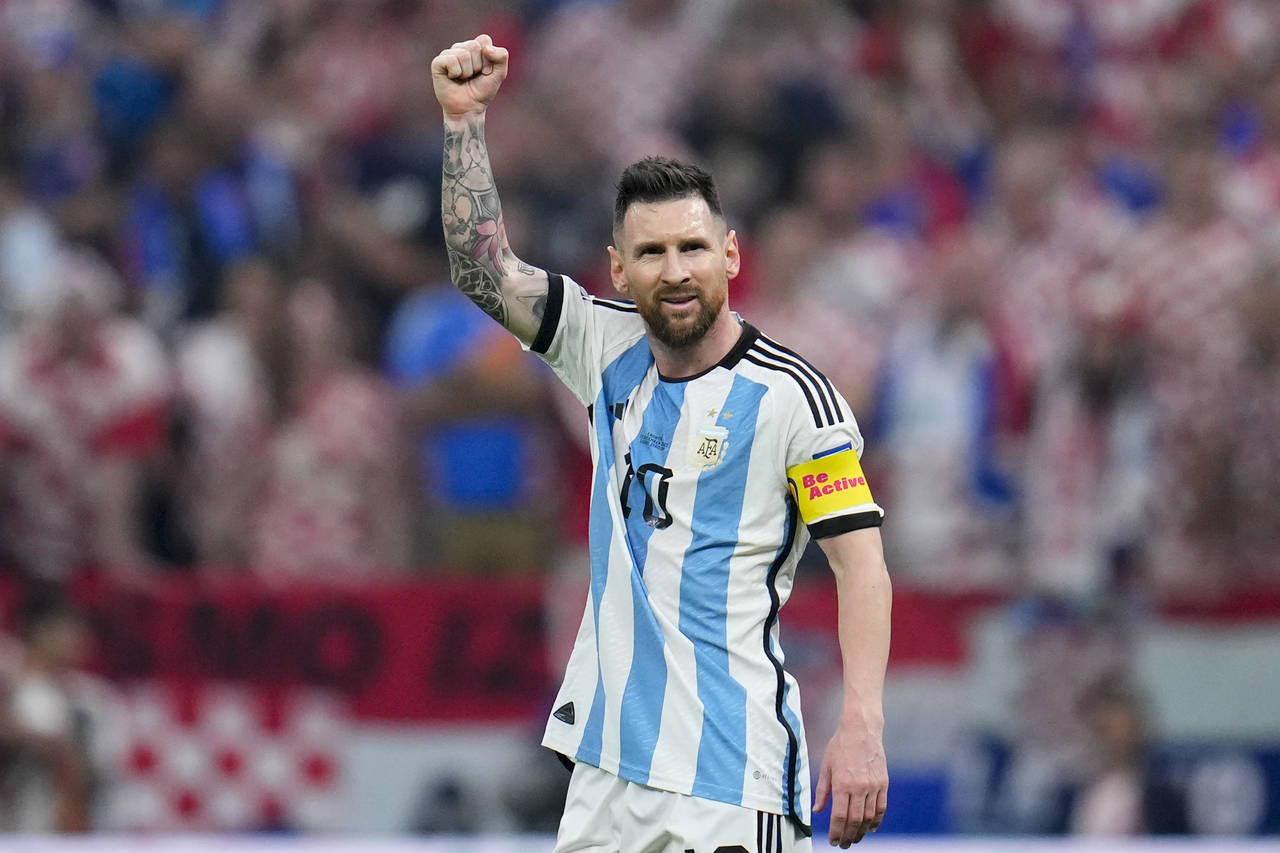 Argentina's Lionel Messi celebrates after scoring from the penalty spot the opening goal during the...