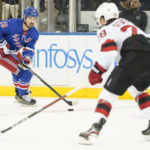 
              New York Rangers left wing Chris Kreider (20) skates against New Jersey Devils defenseman Damon Severson (28) during the first period of an NHL hockey game, Monday, Dec. 12, 2022, at Madison Square Garden in New York. (AP Photo/Mary Altaffer)
            