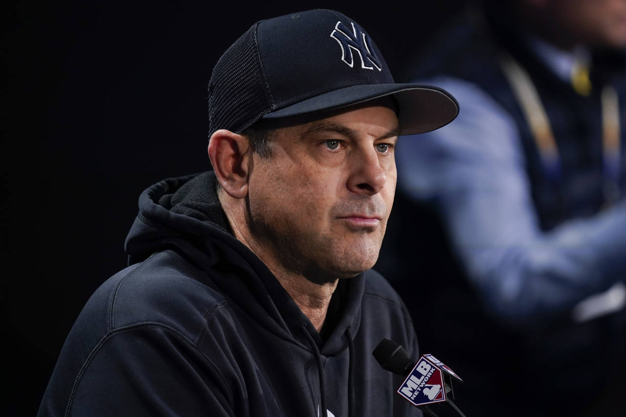 FILE - New York Yankees manager Aaron Boone speaks to reporters before a Game 4 of an American Leag...