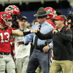 
              Georgia head coach Kirby Smart and Georgia quarterback Stetson Bennett (13) celebrate after defeating LSU in the Southeastern Conference Championship football game Saturday, Dec. 3, 2022 in Atlanta. (AP Photo/John Bazemore)
            