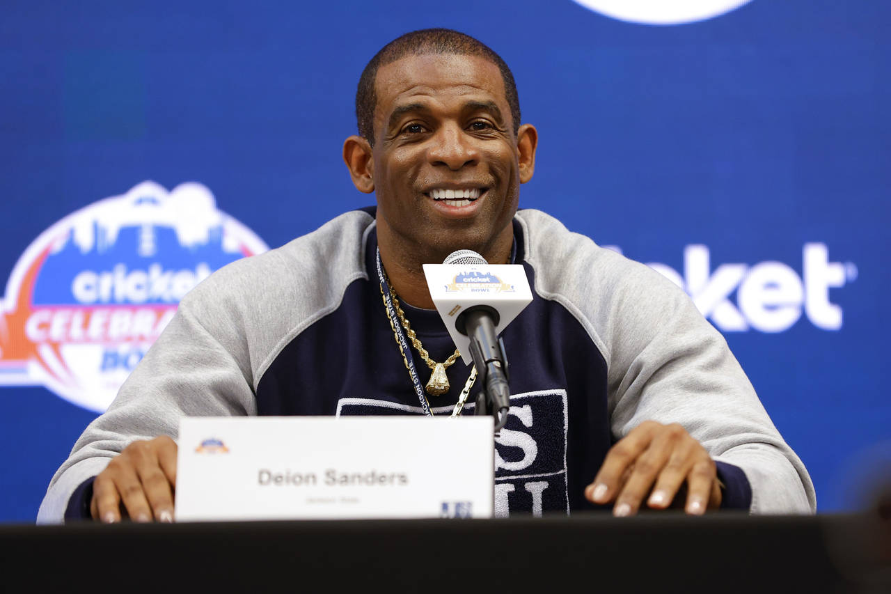 Deion Sanders speaks during a news conference for the Celebration Bowl NCAA college football game b...
