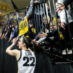 
              Iowa guard Caitlin Clark (22) high-fives fans after an NCAA college basketball game against Dartmouth, Wednesday, Dec. 21, 2022, at Carver-Hawkeye Arena in Iowa City, Iowa. Caitlin Clark had 20 points, 10 rebounds and six assists, and reached 2,000 career points as No. 13 Iowa beat Dartmouth 92-54 or its fifth straight victory.(Joseph Cress/Iowa City Press-Citizen via AP)
            