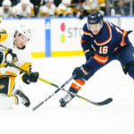 
              Pittsburgh Penguins' Brock McGinn fights for control of the puck with New York Islanders' Aatu Raty (16) during the second period of an NHL hockey game, Tuesday, Dec. 27, 2022, in Elmont, N.Y. (AP Photo/Frank Franklin II)
            
