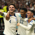 
              England's Phil Foden, right, celebrates with teammates after scoring his side's second goal during the World Cup group B soccer match between England and Wales, at the Ahmad Bin Ali Stadium in Al Rayyan, Qatar, Tuesday, Nov. 29, 2022. (AP Photo/Pavel Golovkin)
            