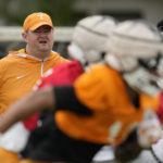 
              Tennessee Volunteers head coach Josh Heupel looks on as players run a drill during a practice session ahead of the 2022 Orange Bowl, Tuesday, Dec. 27, 2022, in Miami Shores, Fla. Tennessee will face the Clemson Tigers in the Orange Bowl on Friday, Dec. 30.(AP Photo/Rebecca Blackwell)
            