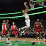 
              Boston Celtics forward Jayson Tatum drives to the basket against the Houston Rockets during the first half of an NBA basketball game, Tuesday, Dec. 27, 2022, in Boston. (AP Photo/Charles Krupa)
            