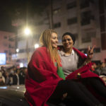
              Moroccans gather to celebrate Morocco's win over Spain in a World Cup soccer match played in Qatar, in Rabat, Morocco, Tuesday, Dec. 6, 2022. (AP Photo/Mosa'ab Elshamy)
            