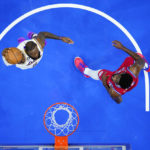 
              Los Angeles Lakers' LeBron James, left, goes up for a dunk against Philadelphia 76ers' Joel Embiid during the first half of an NBA basketball game, Friday, Dec. 9, 2022, in Philadelphia. (AP Photo/Matt Slocum)
            