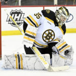 
              Boston Bruins goaltender Linus Ullmark (35) gloves the puck during the second period of an NHL hockey game against the New Jersey Devils Friday, Dec. 23, 2022, in Newark, N.J. (AP Photo/Bill Kostroun)
            