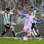 
              Argentina's Julian Alvarez, left, captures the ball beside Australia's goalkeeper Mathew Ryan to scores his side's second goal during the World Cup round of 16 soccer match between Argentina and Australia at the Ahmad Bin Ali Stadium in Doha, Qatar, Saturday, Dec. 3, 2022. (AP Photo/Lee Jin-man)
            