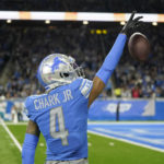 
              Detroit Lions wide receiver DJ Chark (4) reacts after his 41-yard pass reception during the first half of an NFL football game against the Jacksonville Jaguars, Sunday, Dec. 4, 2022, in Detroit. (AP Photo/Paul Sancya)
            