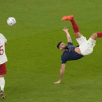 
              FILE - France's Olivier Giroud goes for an overhead kick during the World Cup round of 16 soccer match between France and Poland, at the Al Thumama Stadium in Doha, Qatar, Sunday, Dec. 4, 2022. (AP Photo/Luca Bruno, File)
            