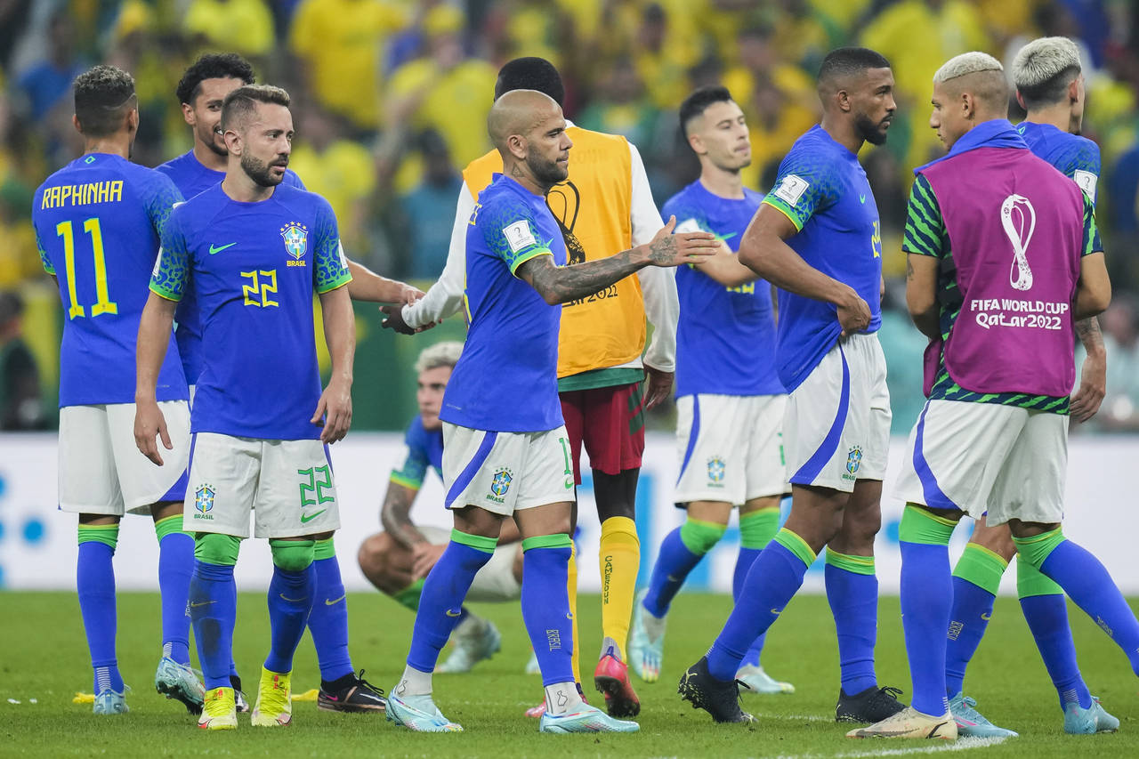 Brazilian players greet each other at the end of the World Cup group G soccer match between Cameroo...