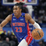 
              Detroit Pistons guard Jaden Ivey drives during the first half of an NBA basketball game against the Dallas Mavericks, Thursday, Dec. 1, 2022, in Detroit. (AP Photo/Carlos Osorio)
            