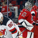 
              Carolina Hurricanes goaltender Pyotr Kochetkov (52) skates back to the net after surviving a barrage of shots by the New Jersey Devils during the first period of an NHL hockey game in Raleigh, N.C., Tuesday, Dec. 20, 2022. (AP Photo/Karl B DeBlaker)
            
