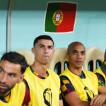 
              Portugal's Cristiano Ronaldo, middle left, sits on the bench before the World Cup round of 16 soccer match between Portugal and Switzerland, at the Lusail Stadium in Lusail, Qatar, Tuesday, Dec. 6, 2022. (AP Photo/Natacha Pisarenko)
            