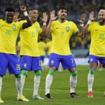 
              Brazil's Neymar, from right, celebrates with team mates Lucas Paqueta, Raphinha and Vinicius Junior after scoring his side's second goal during the World Cup round of 16 soccer match between Brazil and South Korea, at the Stadium 974 in Doha, Qatar, Monday, Dec. 5, 2022. (AP Photo/Manu Fernandez)
            